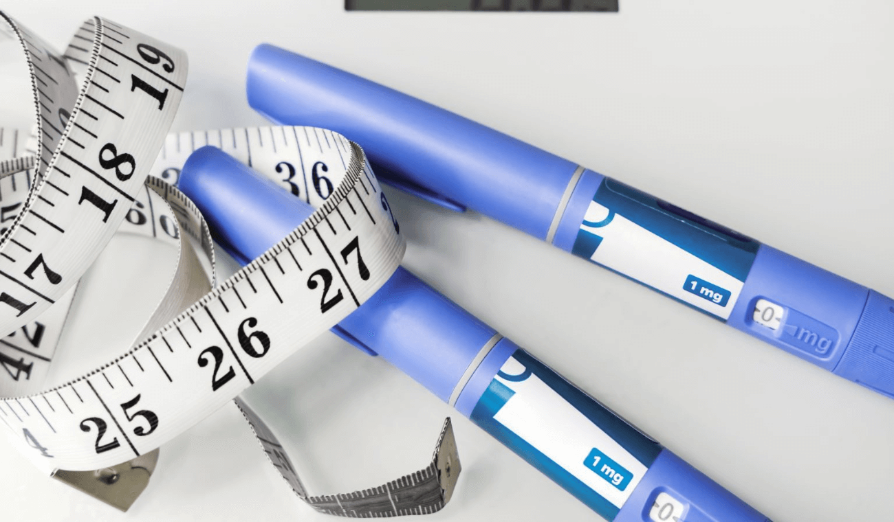 Weight loss jabs and measuring tape